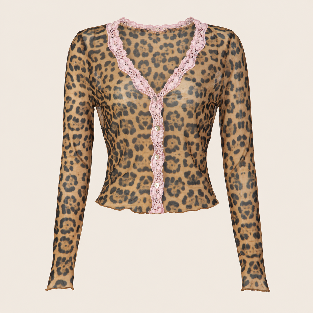 Cardigan léopard à détails dentelle — vêtement seul sur fond beige